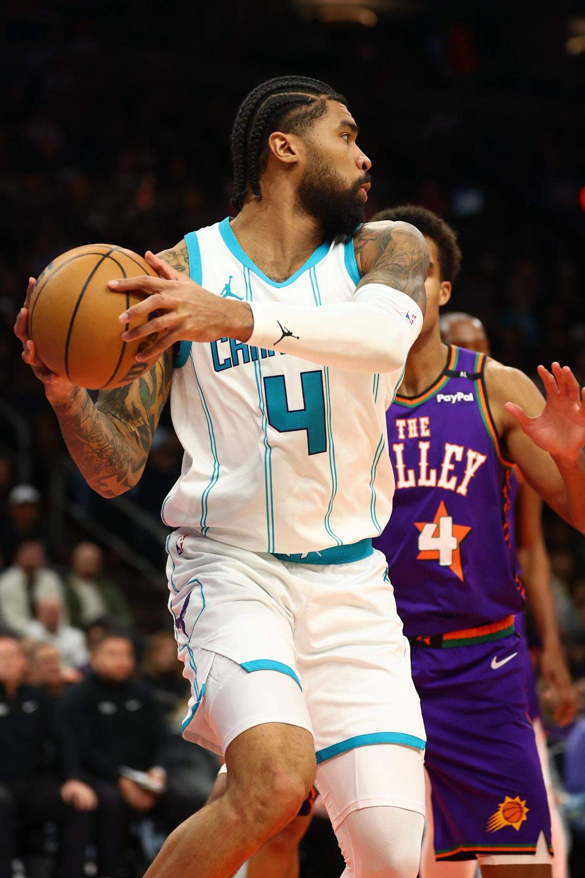 Charlotte Hornets center Nick Richards (4) grabs a rebound against the Phoenix Suns during the second half at Footprint Center.