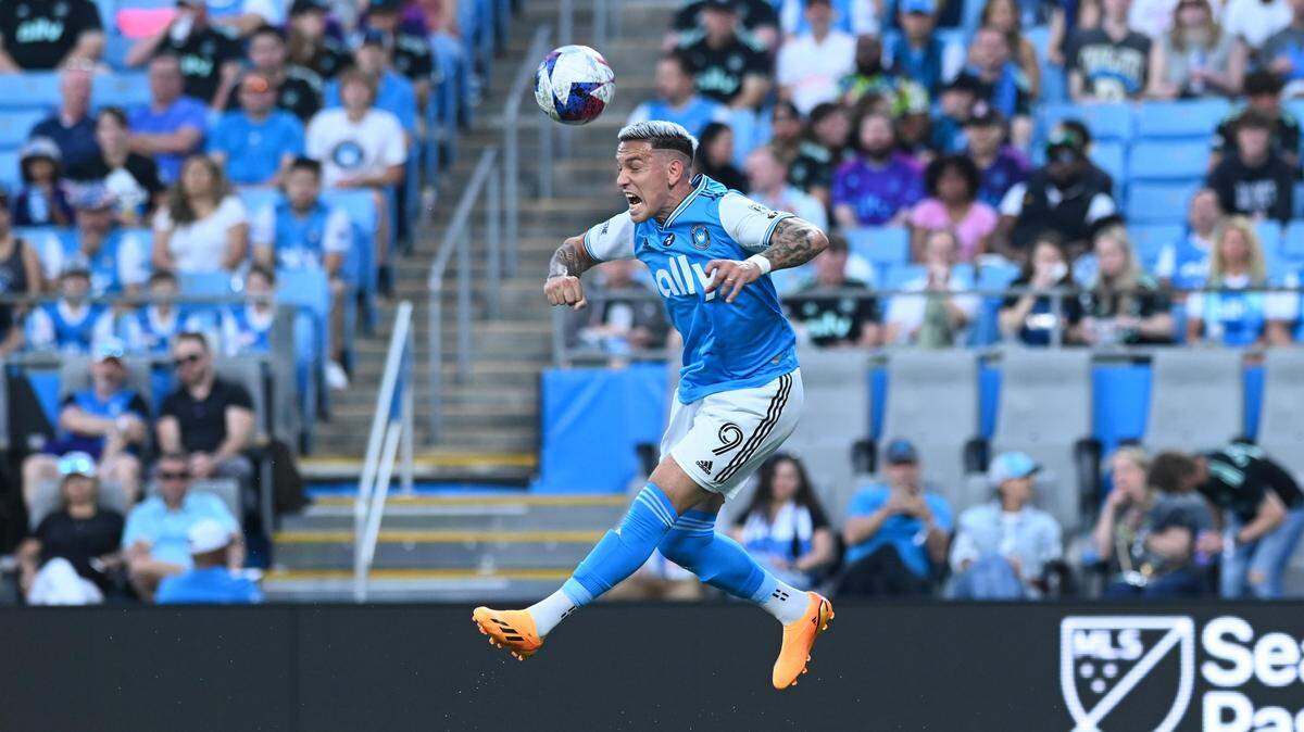 Charlotte FC attacker Enzo Copetti (9) heads the ball in the first half of Saturday’s match against New York City FC at Bank of America Stadium. Griffin Zetterberg-USA TODAY Sports