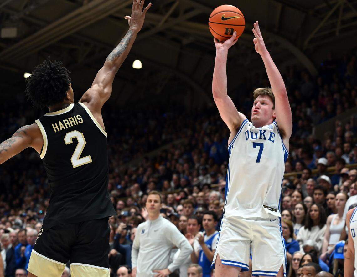 Mar 3, 2025; Durham, North Carolina, USA; Duke Blue Devils forward Kon Knueppel (7) shoots over Wake Forest Demon Deacons guard Juke Harris (2) during the second half at Cameron Indoor Stadium. The Blue Devils won 93-60.