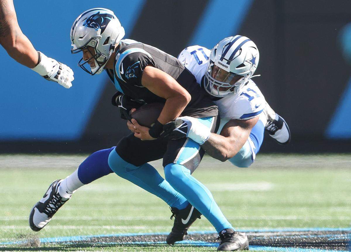 Panthers quarterback Bryce Young (9) is sacked by Cowboys linebacker Micah Parsons (11) during the game at Bank of America Stadium on Sunday, November 19, 2023 in Charlote, NC.