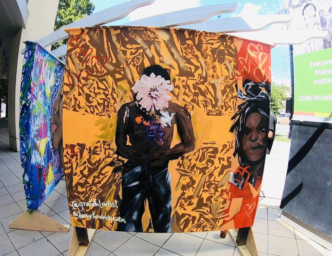 A panel by Adelle Patten, a senior studio art student at Davidson College who worked with Makayla Binter on her mural panel project, is displayed in front of the Levine Museum of the New South in Charlotte. 