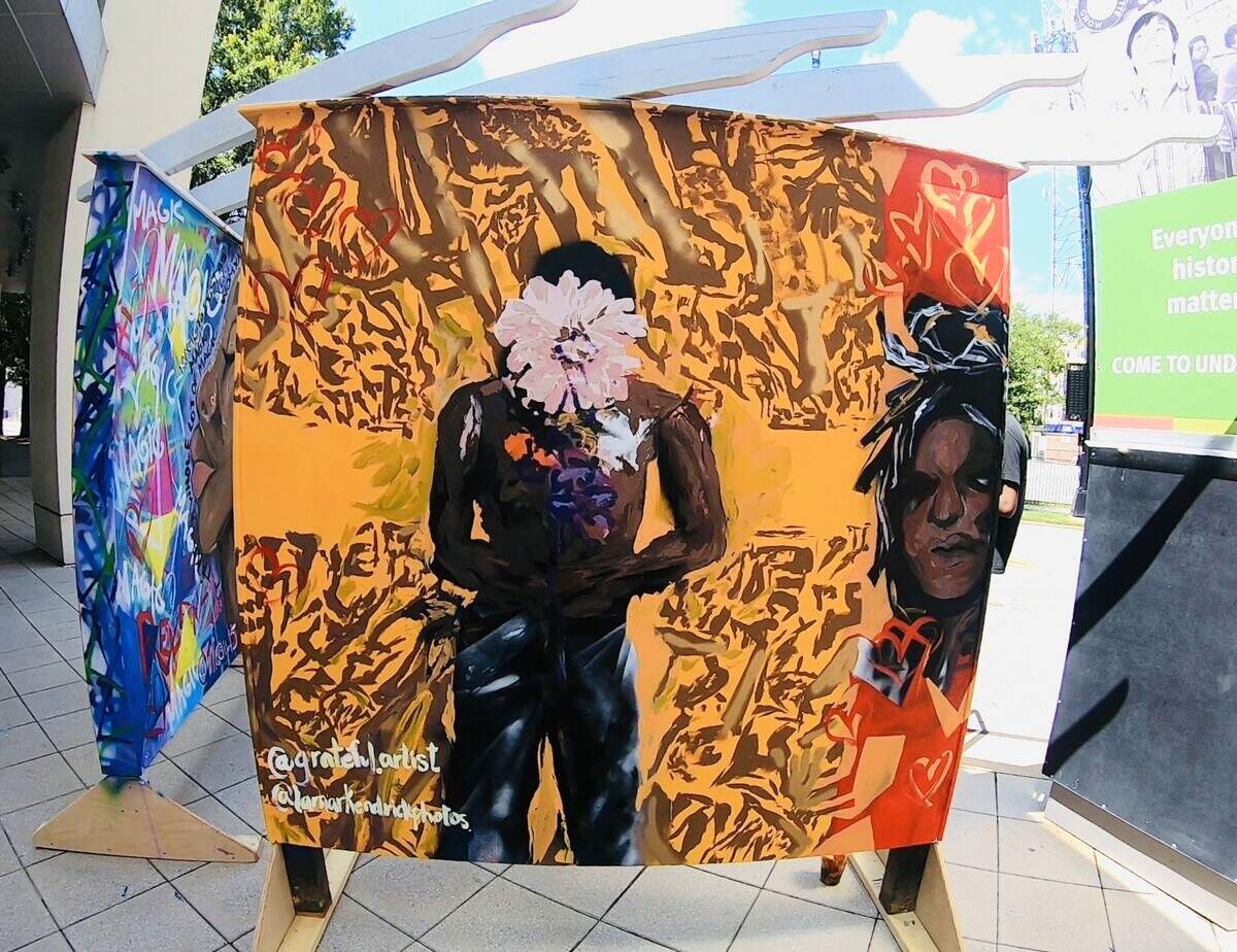 A panel by Adelle Patten, a senior studio art student at Davidson College who worked with Makayla Binter on her mural panel project, is displayed in front of the Levine Museum of the New South in Charlotte. 