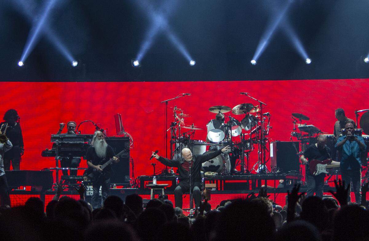 Phil Collins points to a packed crowd at the Spectrum Center in Charlotte on Sunday, September 29, 2019.
