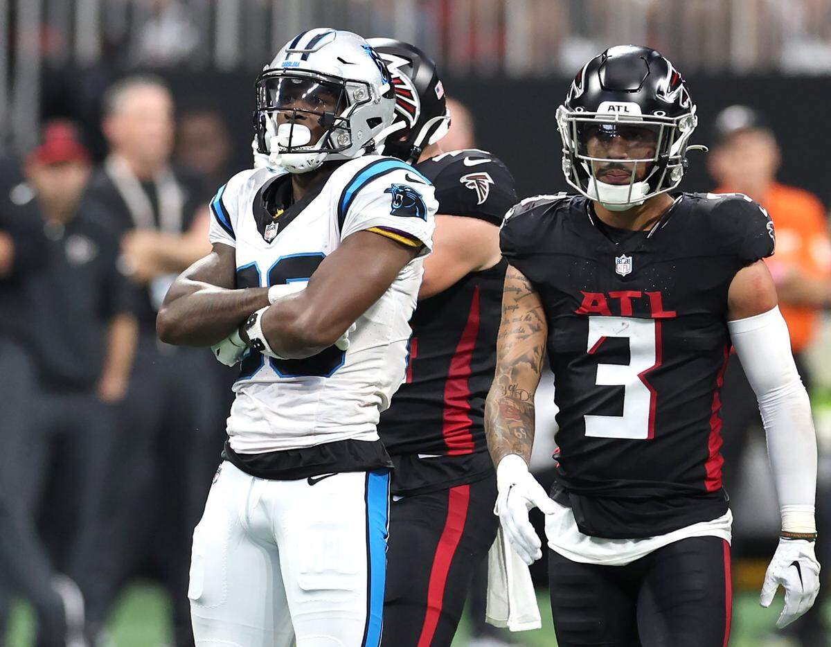 Carolina Panthers wide receiver Terrace Marshall celebrates his pass reception during first half action as Atlanta Falcons safety Jessie Bates III, right, passes at Mercedes-Benz Stadium in Atlanta, GA on Sunday, September 10, 2023. The Falcons defeated the Panthers 24-10.