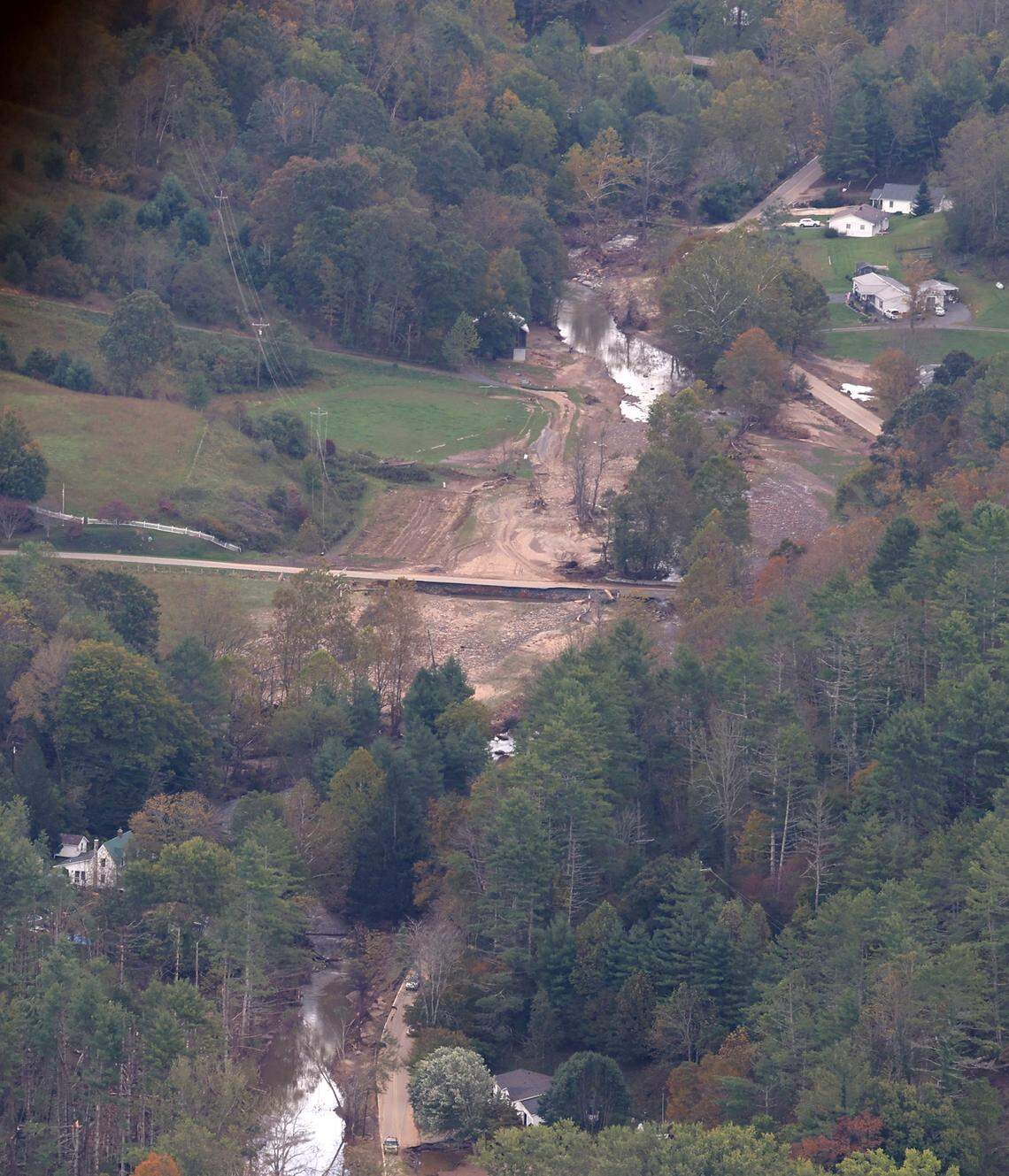 Flood damage can be seen from the Chinook helicopter flown by Bravo Company 1-171 to Western North Carolina on Thursday, Oct. 3, 2024. The company flew pallets of bottled water and ready to eat meals to the Buladean and Poplar areas, which are suffering the effects of Hurricane Helene.