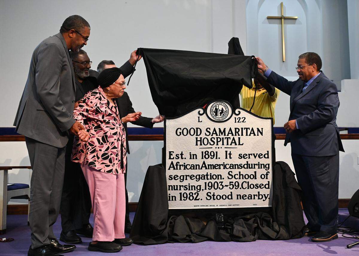 A North Carolina highway historical marker recognizing Good Samaritan Hospital is unveiled curing a ceremony at Ebenezer Baptist Church in Charlotte on Thursday, May 28, 2026. Good Samartian Hospital was built to serve the medical needs of Black people in Charlotte. Additionally, it was the first privately funded hospital in North Carolina which served Black patients. The original building was destroyed in 1996 to make way for construction of what is now Bank of America Stadium. 