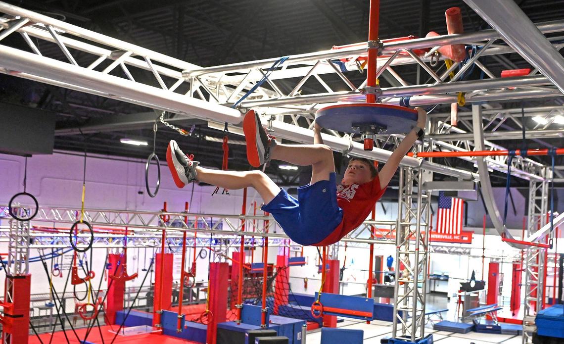 Bentley Boyd, 8., works his way through a competition course at Ninja Nation. Boyd is ranked No. 1 in the world for Kids Male Division in the World Ninja League.