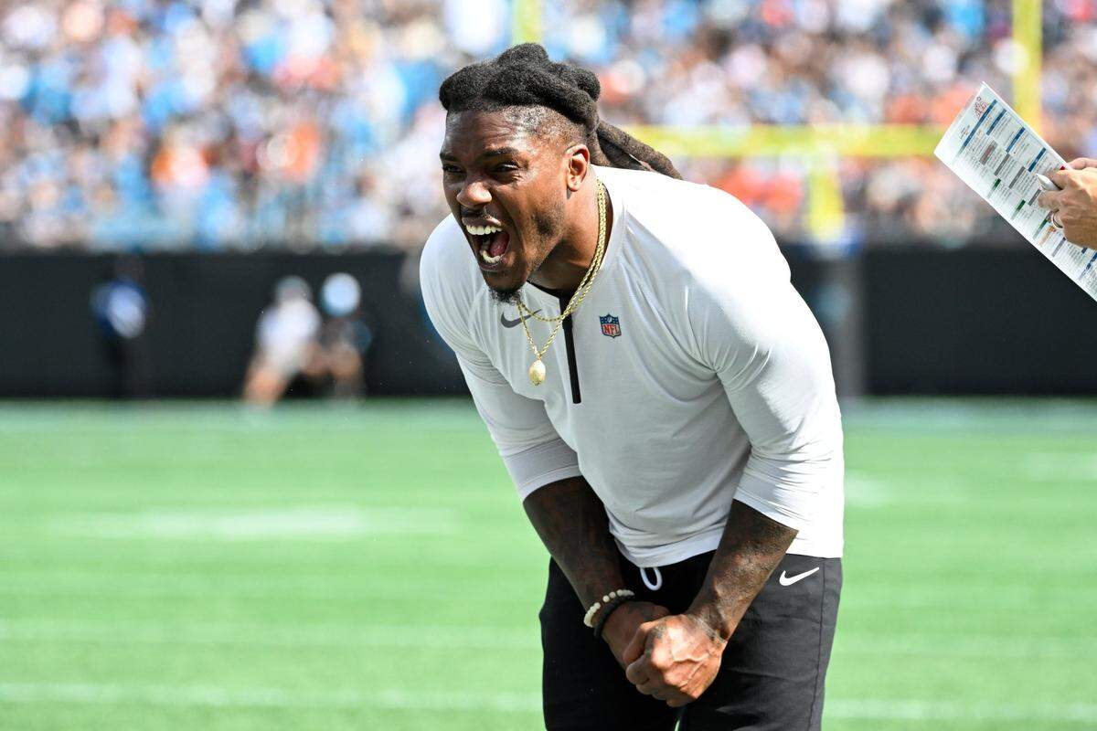 Sep 29, 2024; Charlotte, North Carolina, USA; Carolina Panthers Special Teams Assistant Daren Bates celebrates in the third quarter at Bank of America Stadium. Mandatory Credit: Bob Donnan-Imagn Images