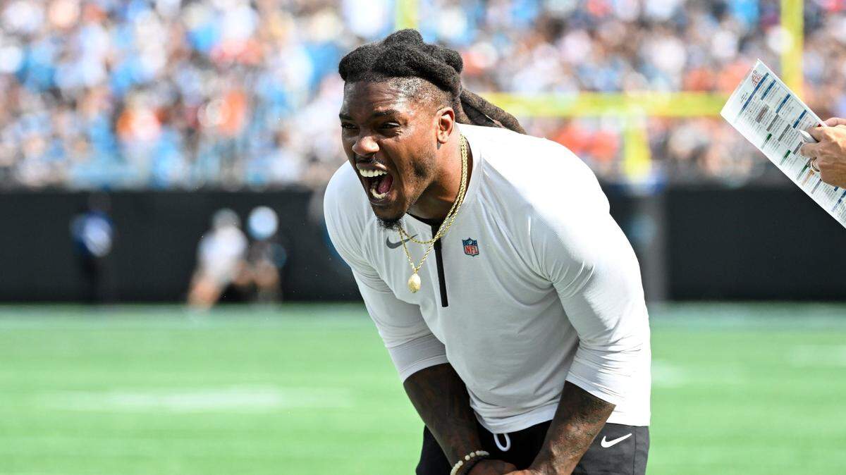 Sep 29, 2024; Charlotte, North Carolina, USA; Carolina Panthers Special Teams Assistant Daren Bates celebrates in the third quarter at Bank of America Stadium. Mandatory Credit: Bob Donnan-Imagn Images