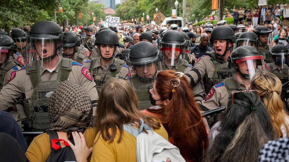 Texas state troopers in riot gear try to break up a pro-Palestinian protest at the University of Texas, Wednesday, April 24, 2024, in Austin, Texas.