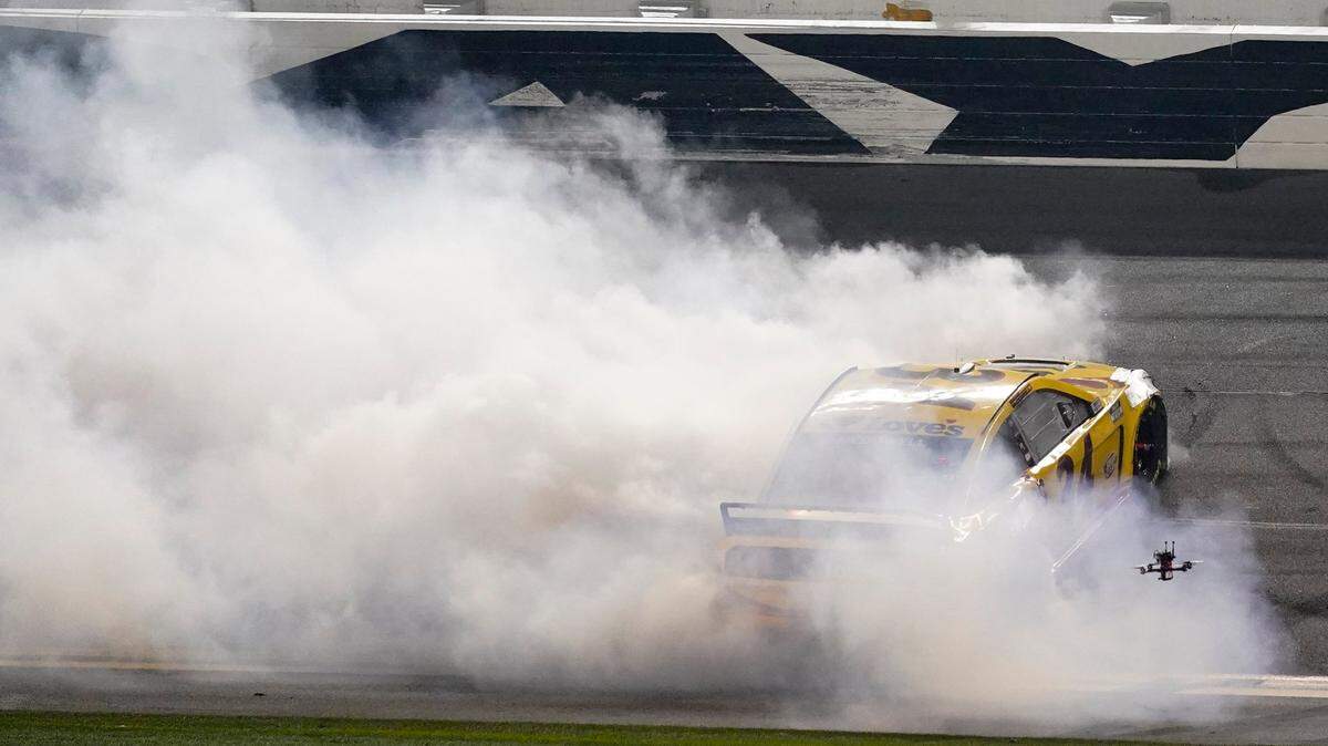 Michael McDowell celebrates after winning the NASCAR Daytona 500 auto race at Daytona International Speedway, Monday, Feb. 15, 2021, in Daytona Beach, Fla. (AP Photo/John Raoux)