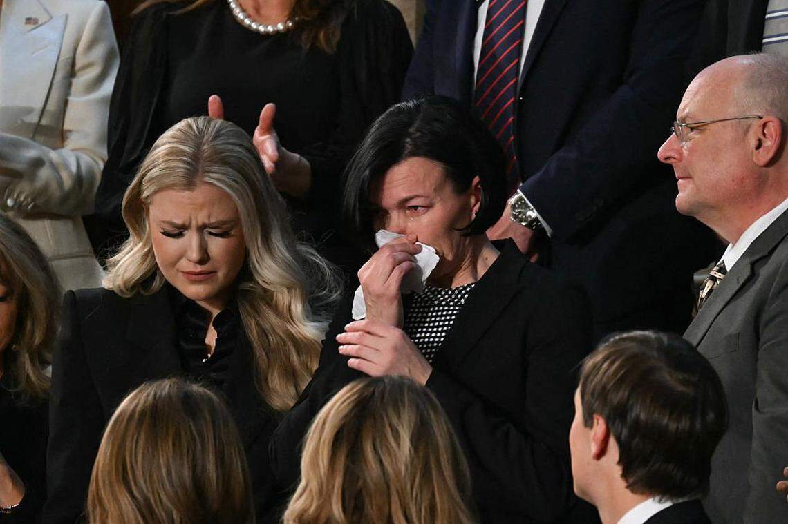 Erika Kirk, left, widow of the late conservative activist Charlie Kirk, looks on as Anna Zarutska, the mother of Iryna Zarutska, is recognized by US President Donald Trump during the State of the Union address in the House Chamber of the US Capitol in Washington, DC, on February 24, 2026.