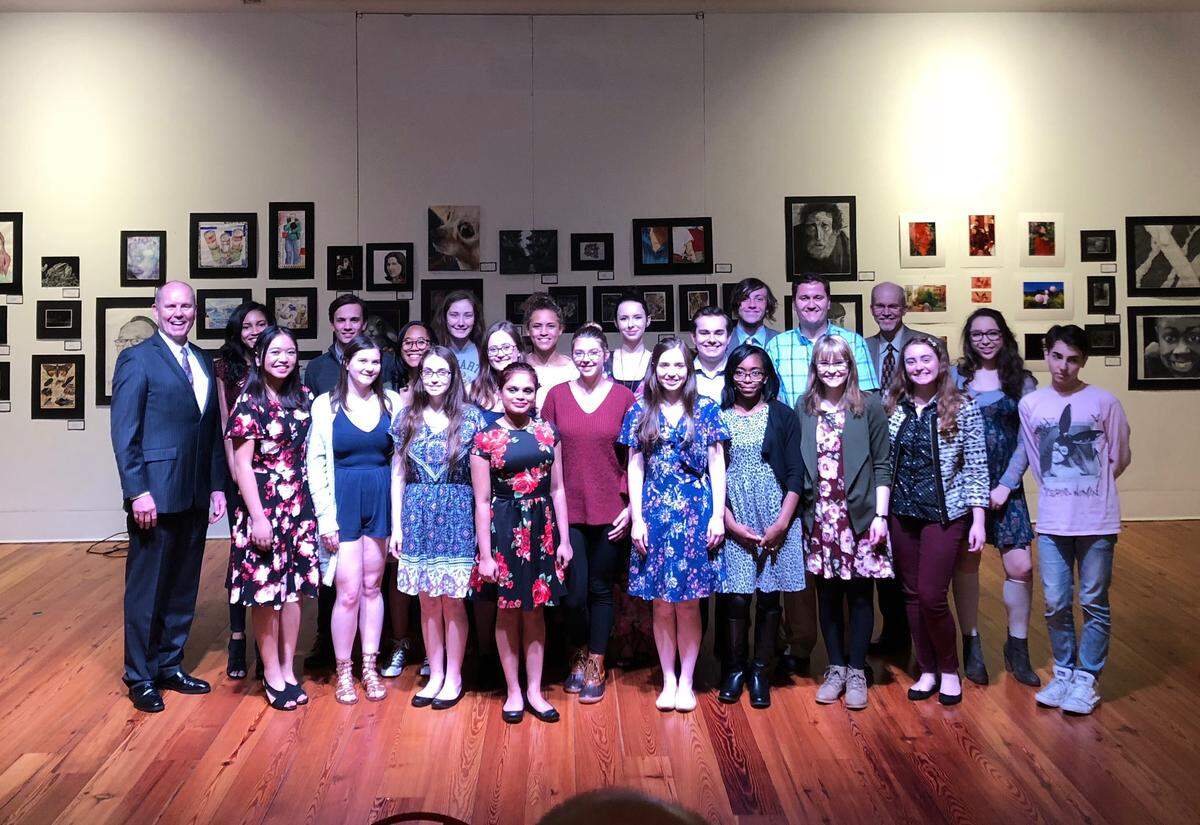 Ralph Beck poses with students who participated in the Junior Ambassadors program at the Blumenthal Performing Arts Center.