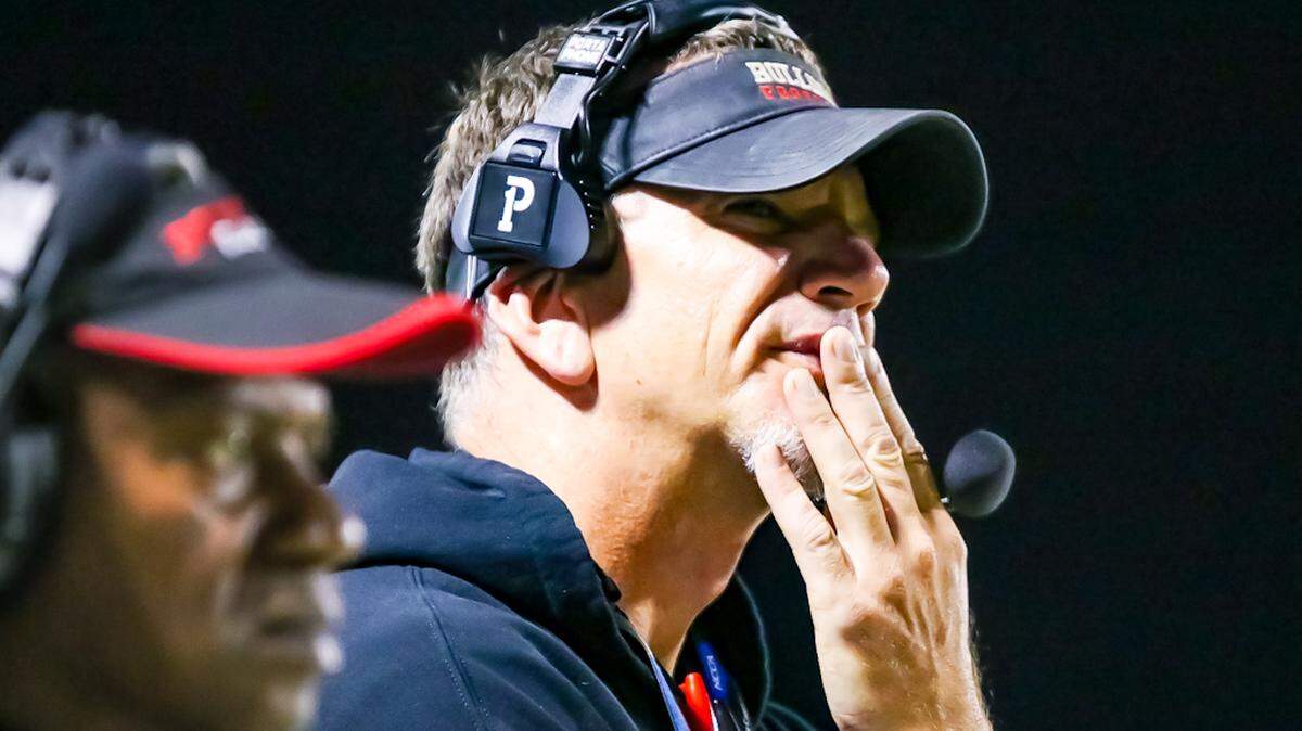 Butler Head Coach Brian Hales looks to the field to watch his team attempt to score