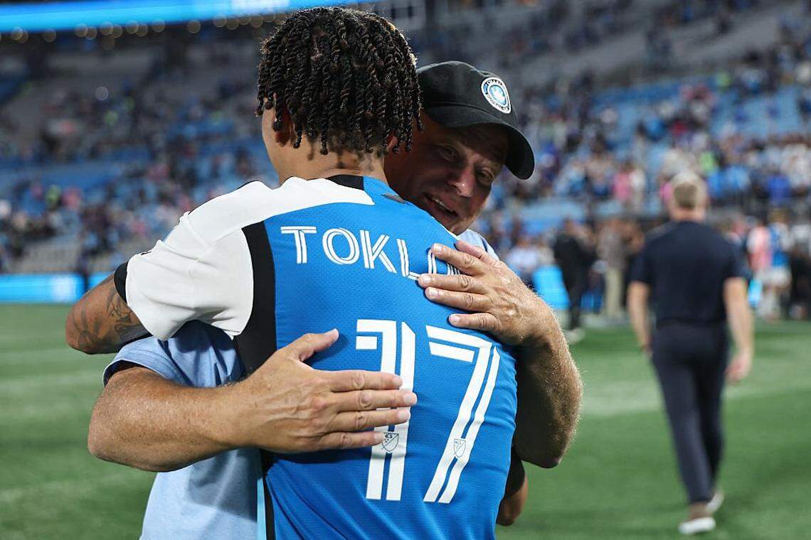 CHARLOTTE, NORTH CAROLINA - SEPTEMBER 13: Idan Toklomati #17 of Charlotte FC celebrates with David Tepper, owner of Charlotte FC, after winning the MLS match between Charlotte FC and Inter Miami CF at Bank of America Stadium on September 13, 2025 in Charlotte, North Carolina. (Photo by David Jensen/Getty Images)