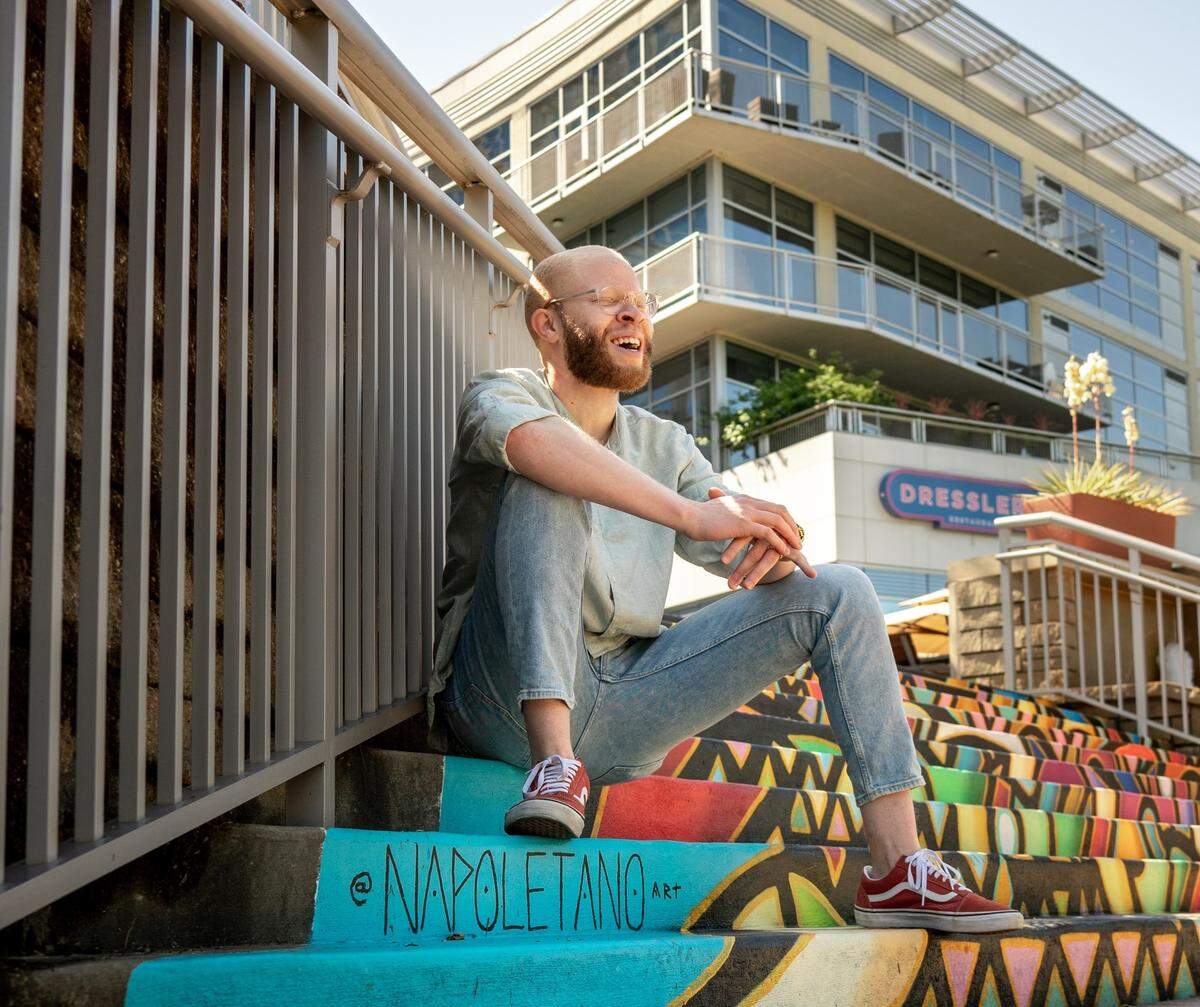 Join local photographer and podcast host Gavin Boulware for a photo workshop celebrating Albinism Awareness Day. Mural by Nick Napoletano.