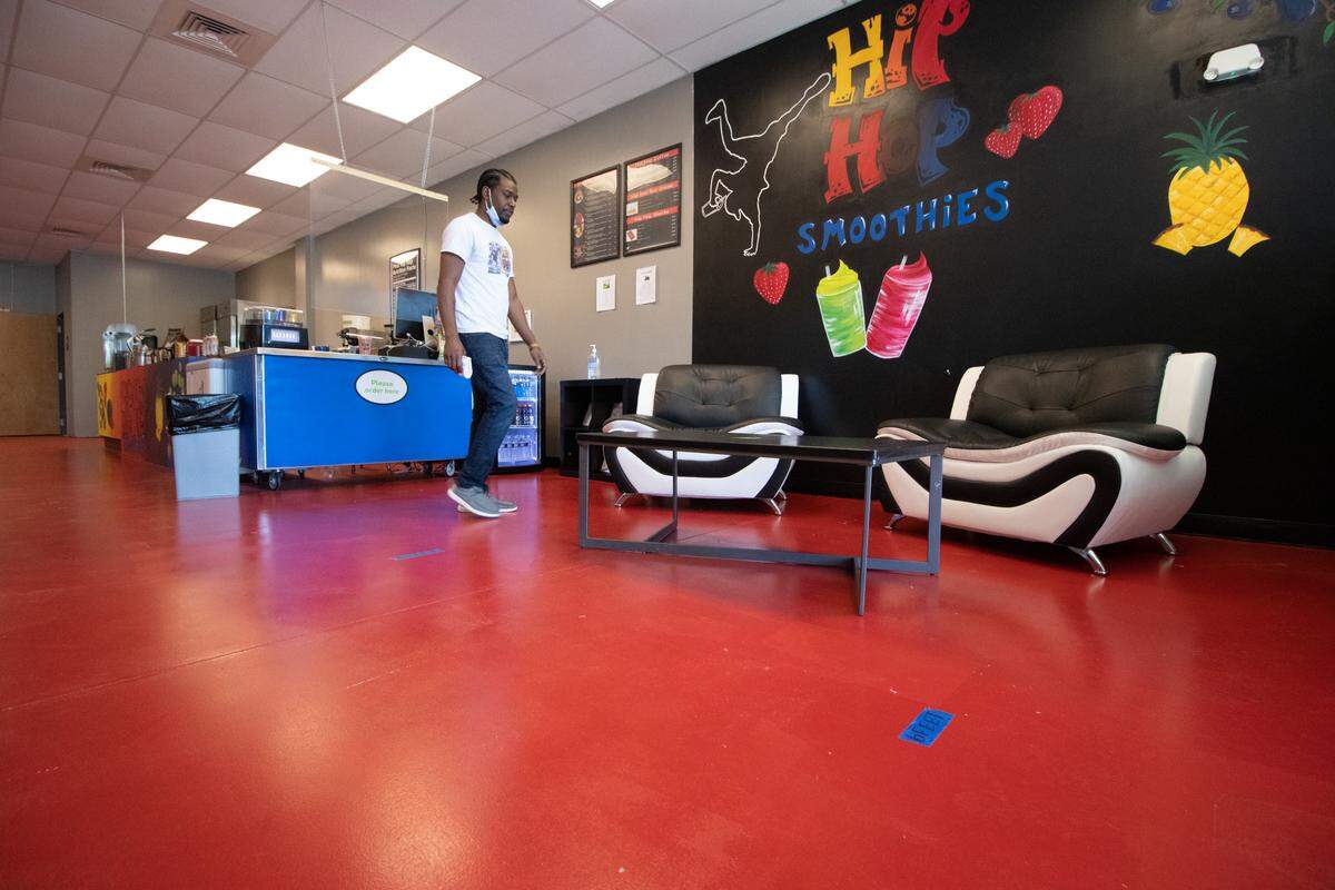 Hip Hop Smoothies co-owner Roberto Brooks stays busy sanitizing surfaces at his store at 249 Mt Holly-Huntersville Rd. Suite 210 in Charlotte.