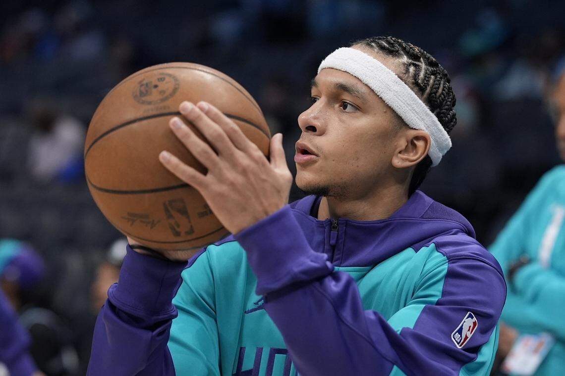 Charlotte Hornets guard Tre Mann (23) shoots during warm ups before the first quarter against the Detroit Pistons at Spectrum Center.