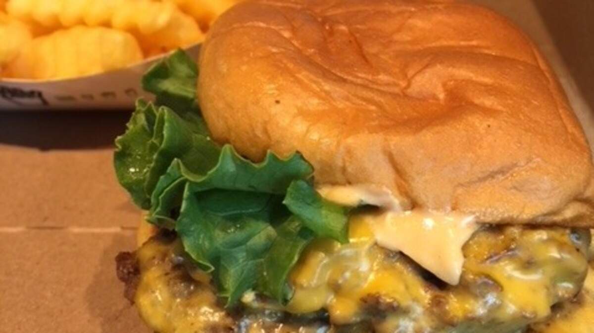 Shake Shack’s double Stack burger is served on a potato roll with Shack Sauce and lots of cheese, but it’s smaller.