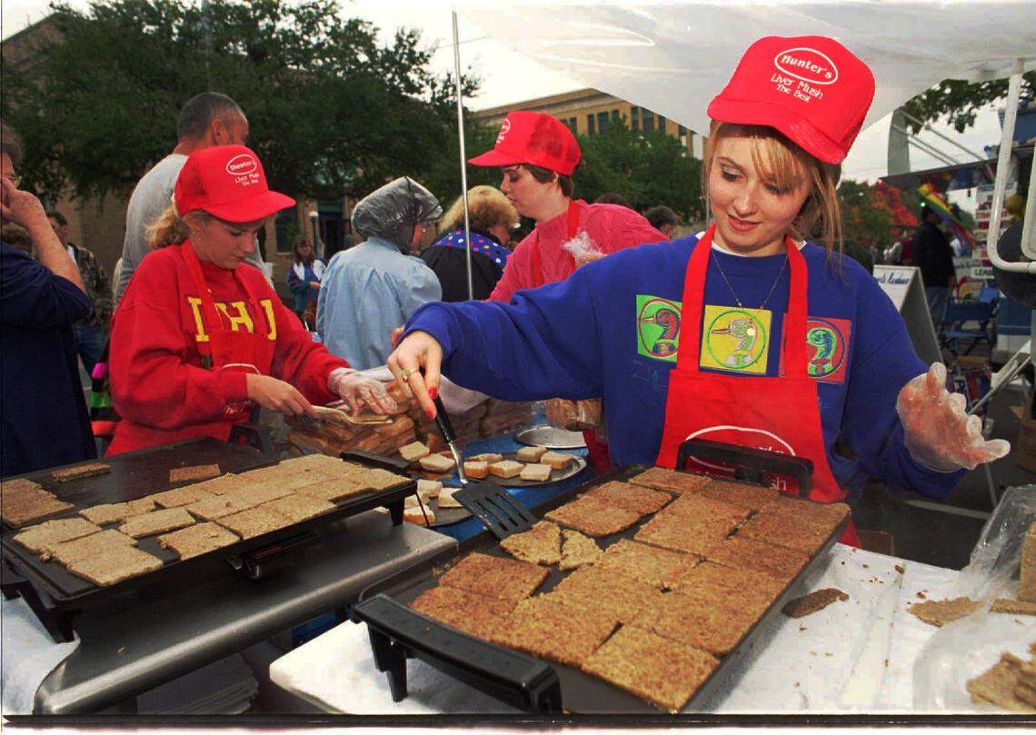 In this 1993 file photo, Elizabeth Hunter, 17, at right, and cousin Bonita Dover, 16, both of Marion, fry fresh slices of their grandparents’ livermush at the annual Livermush festival in Shelby. Due to COVID-19, the 2021 festival is being held online only.
