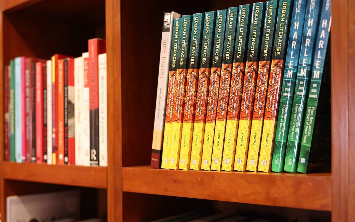 Books authored by Valerie Kinloch, the President of Johnson C. Smith University, have their own shelf in her office in Charlotte on Tuesday, June 18, 2024.