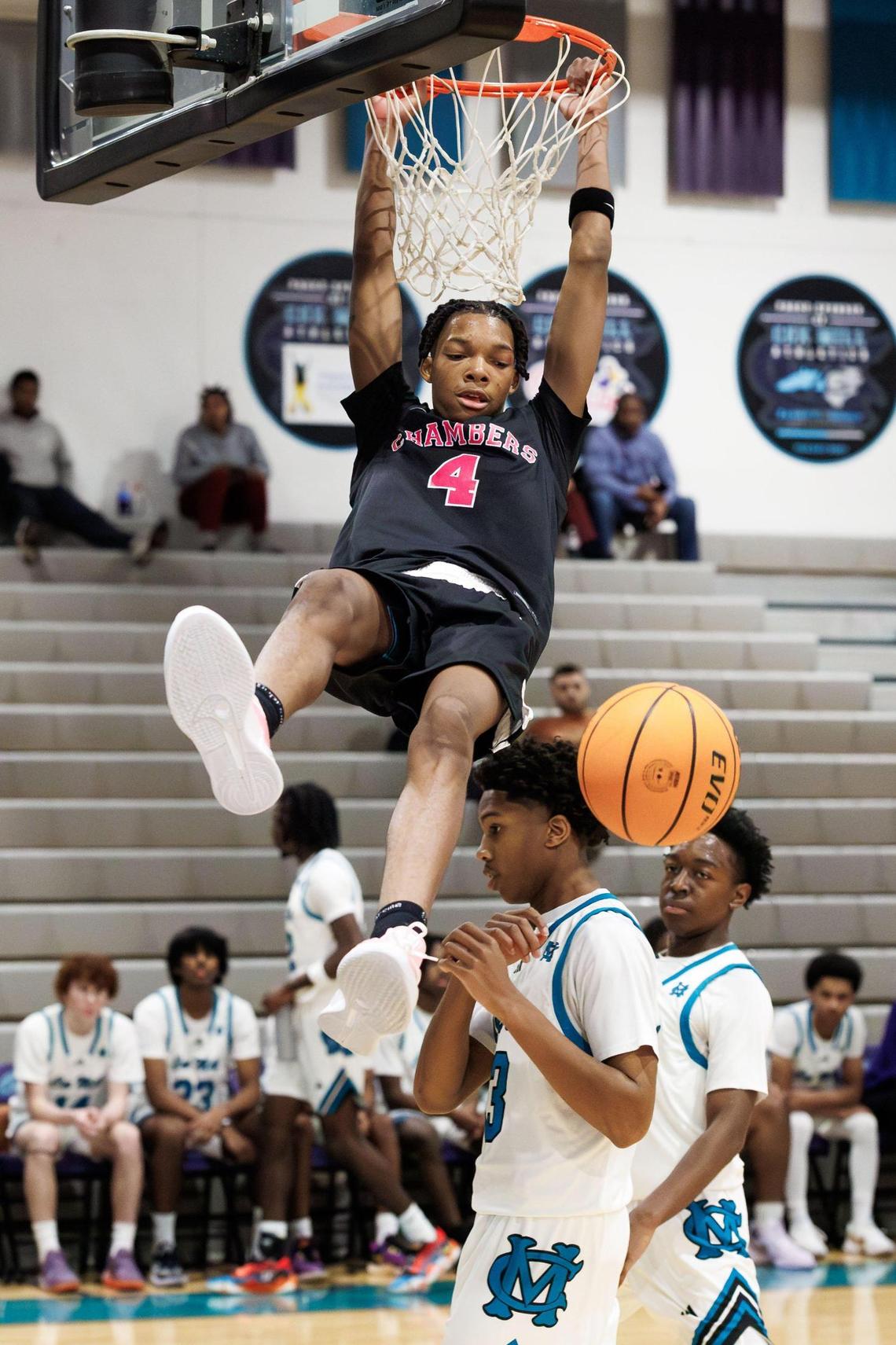 Chamber’s Tarris Bouie III (4) gets the dunk during early 1st half action. Cox Mill high school would host the Mike Gminski Classic Monday December 23, 2024.