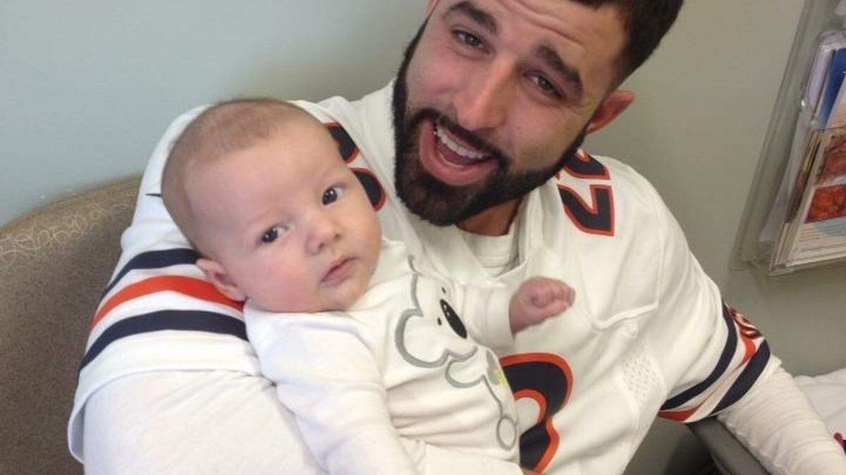 Nick Carusillo holds his son.