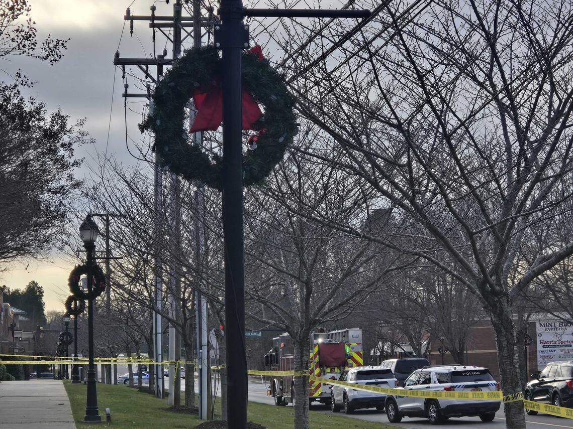 Wreaths line Mint Hill near the scene where two police officers were shot on Friday, Dec. 26, 2025, and a suspect fatally shot.