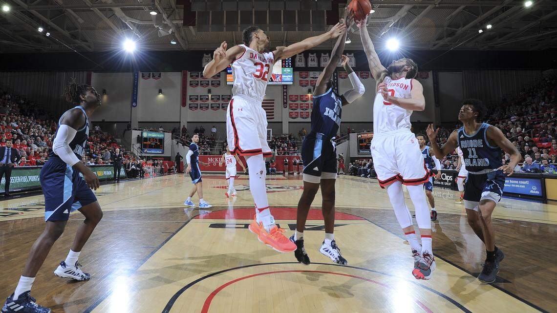 Davidson’s Nelson Boachie-Yiadom (32) and Jon Axel Gudmundsson (3) go for a rebound against Rhode Island’s Cyril Langevine.
