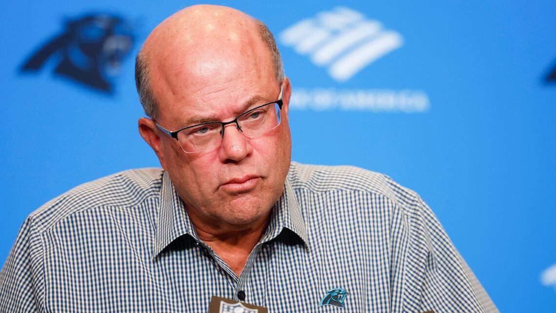 Carolina Panthers owner David Tepper listens to a question during a press conference in 2022.