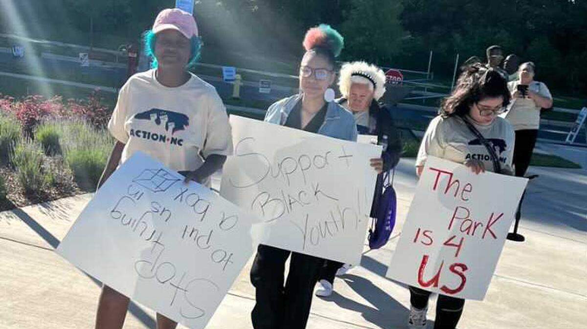 A group of protesters outside the May 10 Mecklenburg County Park and Recreation Commission meeting protesting the charges levied on them by the Park and Recreation Commission to host a Juneteenth event at Romare Bearden Park