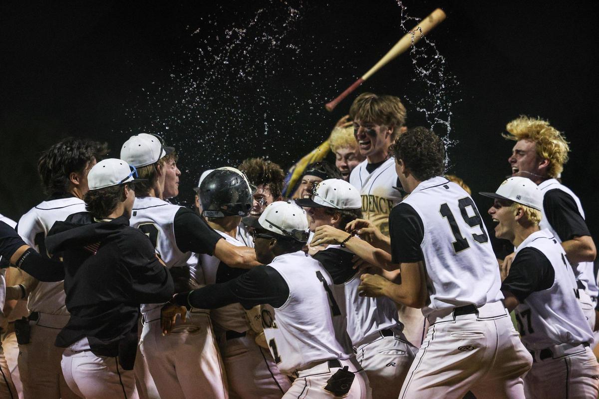Providence’s bench empties onto the field to celebrate Xavier McCoury’s home run in the bottom of the eigth inning, giving them a 5-4 victory over Charlotte Catholic in the Southwestern 4A championship baseball game at Garinger High School in Charlotte, NC on Thursday, May 1, 2025.
