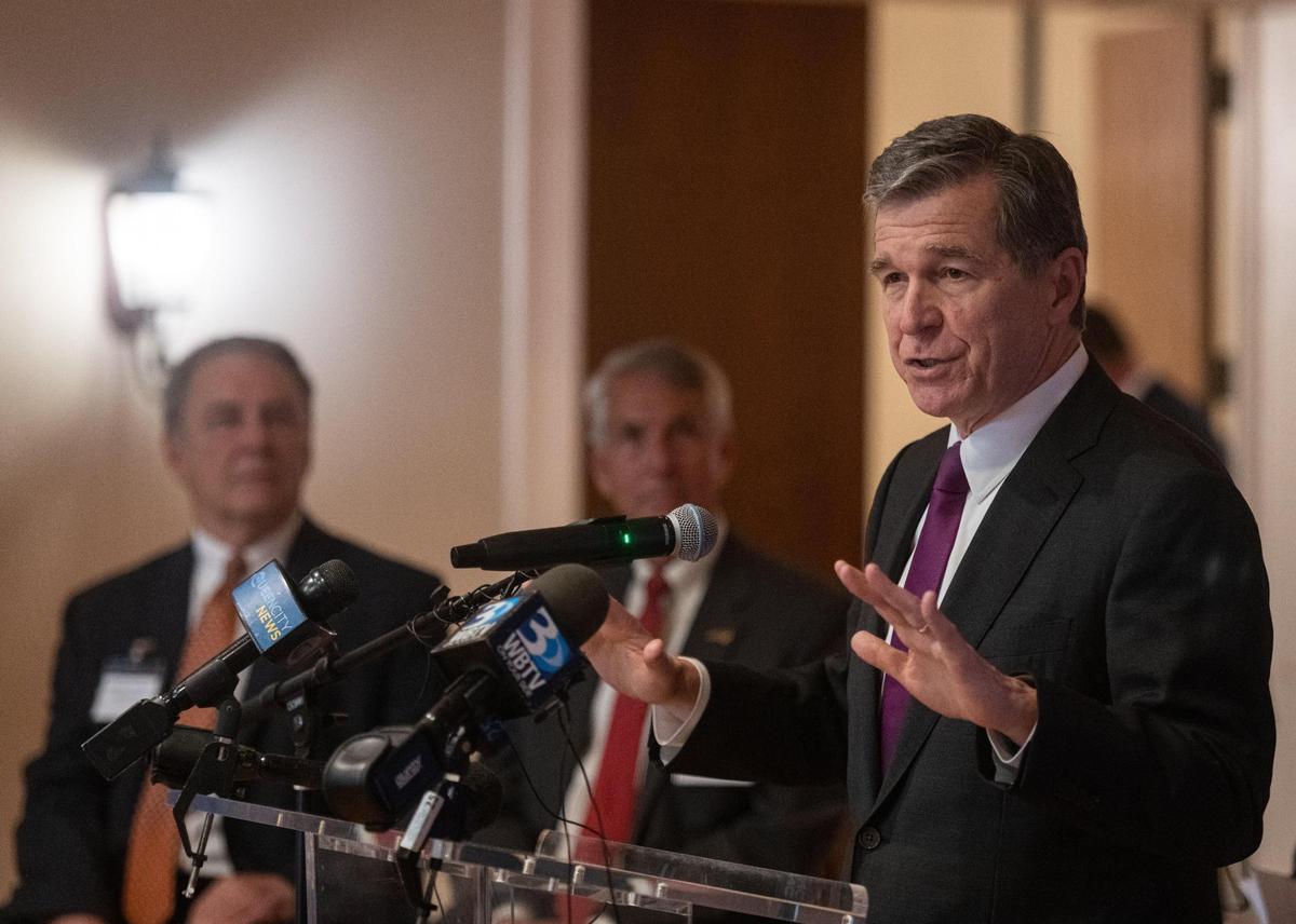 North Carolina Governor Roy Cooper delivers remarks at the Cabarrus Country Club alongside members of local government and Eli Lilly and Company before a groundbreaking ceremony for a new pharmaceutical manufacturing plant in Concord, N.C., Tuesday, June 14, 2022.