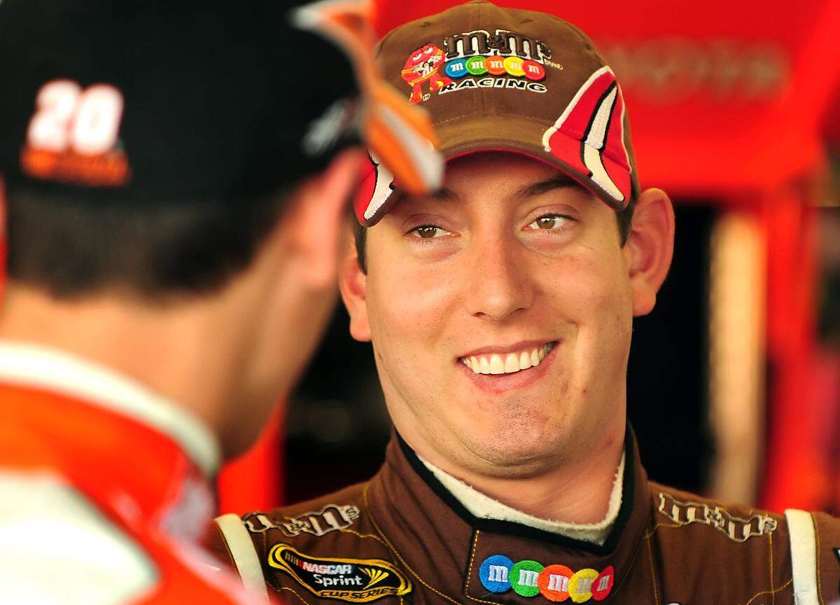 2/13/09 (R-L) NASCAR driver Kyle Busch enjoys a break in the garage with driver Joey Logano following practice Friday at Daytona International Speedway. Busch ran a few practice laps in Logano's (20) Home Depot Toyota during the session.  JEFF SINER - jsiner@charlotteobserver.com