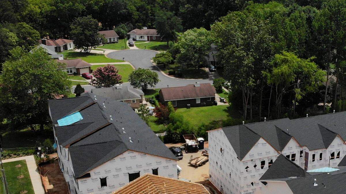 Construction continues on townhomes in the Six Twenty subdivision along East Woodland Road in Charlotte’s Collingwood neighborhood on Monday, July 25, 2022.