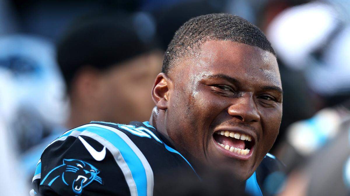 Carolina Panthers defensive end Derrick Brown smiles at his teammates following a series against the Tampa Bay Buccaneers during second-quarter action at Bank of America Stadium in Charlotte, NC on Sunday, January 7, 2024.