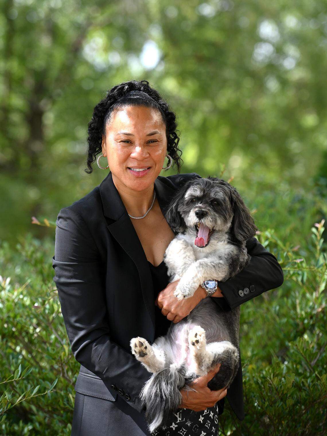 University of South Carolina head women’s basketball coach Dawn Staley and her dog Champ in a photo taken in 2022. Staley’s Gamecocks are the defending national champions.