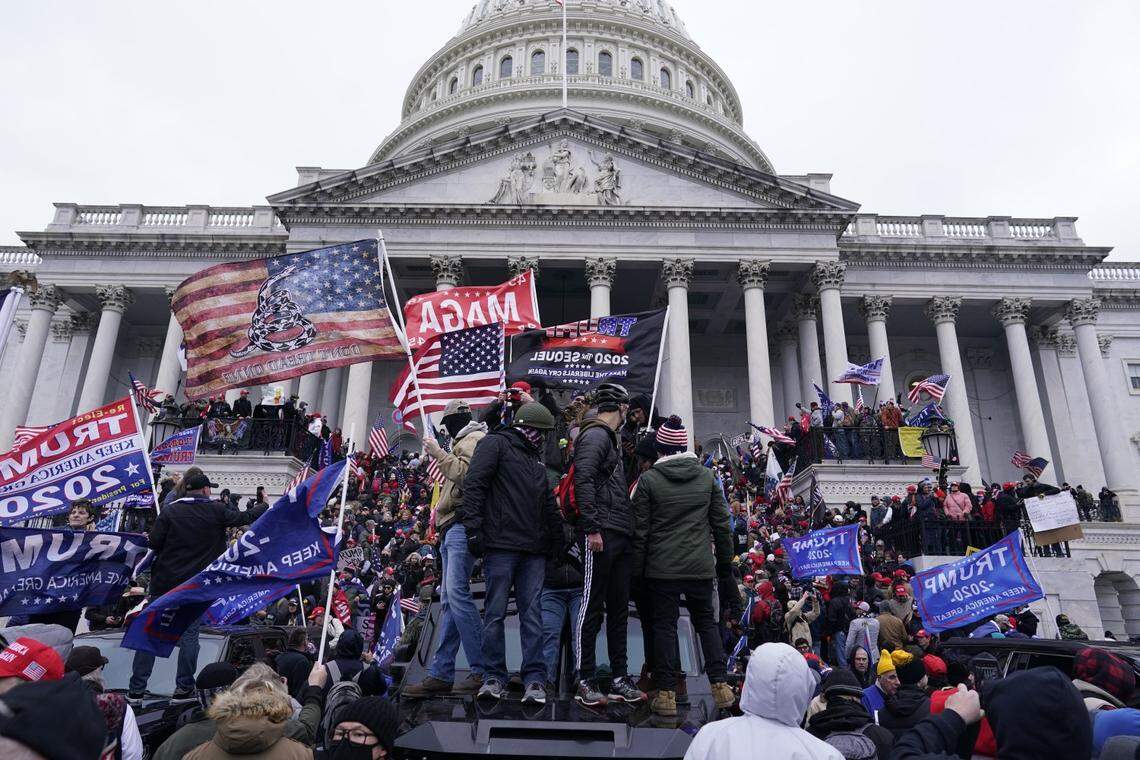 Pro-Trump supporters storm the U.S. Capitol on Jan. 6 to disrupt the certification of President Joe Biden’s win. This week, a seventh N.C. resident was arrested in connection with the violence.