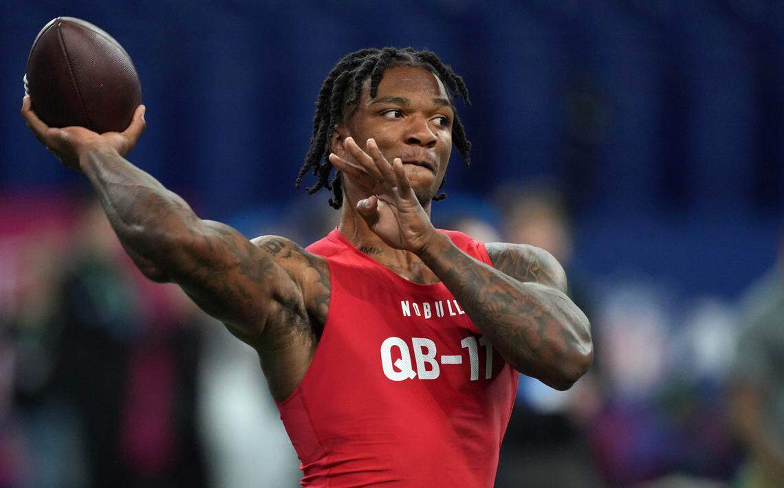 Florida quarterback Anthony Richardson (QB11) participates in drills at Lucas Oil Stadium.