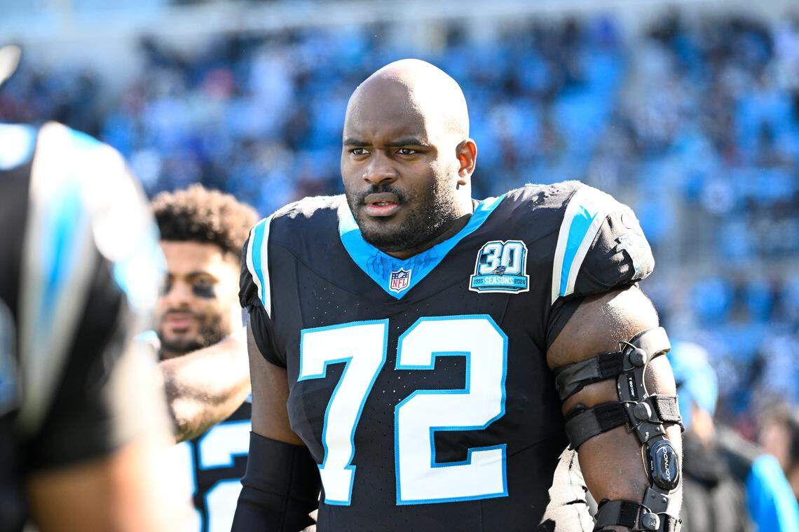 Dec 22, 2024; Charlotte, North Carolina, USA; Carolina Panthers offensive tackle Taylor Moton (72) on the sidelines before the game at Bank of America Stadium. Mandatory Credit: Bob Donnan-Imagn Images