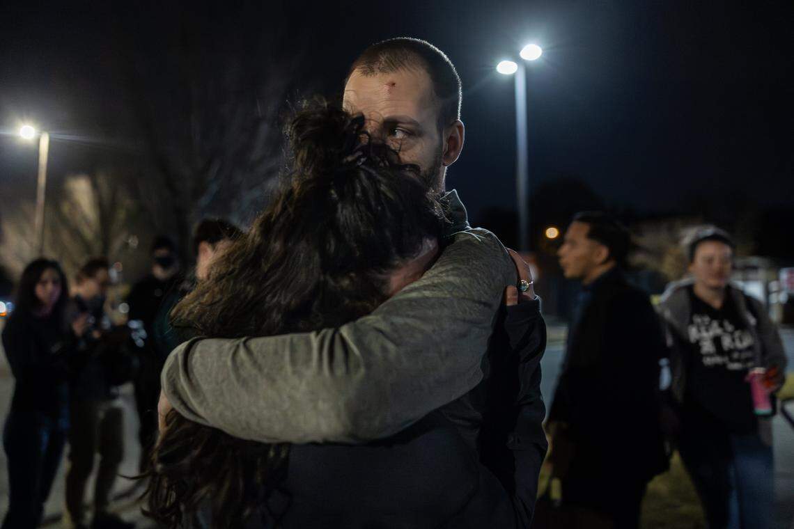 Joshua Long hugs his partner, Gabrielle Sorge, after he is released from the FBI Charlotte field office in Charlotte on Tuesday, November 18, 2025.