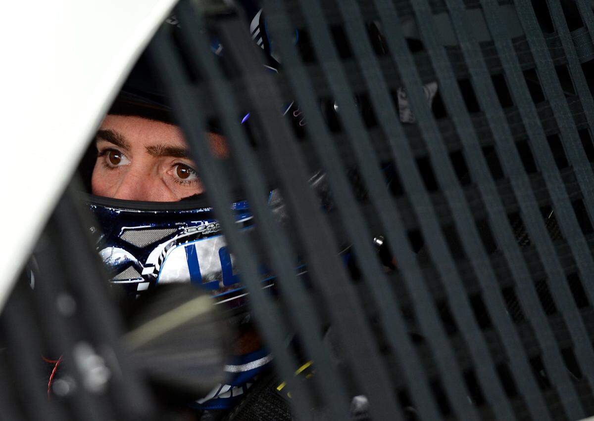 In 2013, seven-time NASCAR Cup champion Sprint Cup Jimmie Johnson was a picture of determination as he prepared to exit the garage for practice at Charlotte Motor Speedway in Concord, NC.