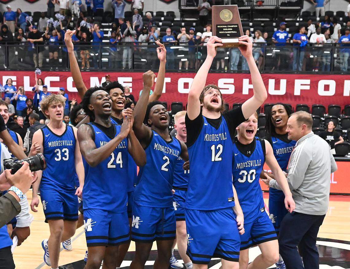 Members of the Mooresville basketball team celebrate their 55-52 win over North Meck in the boy’s 7A NCHSAA regional championship game at Lenoir-Rhyne University in Hickory, NC on Friday, March 6, 2026.