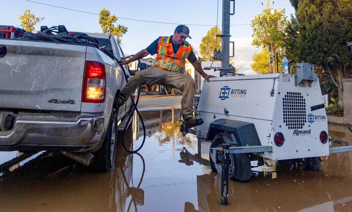 Nick Morel, an offshore operator, refuels a portable light in Biltmore Village in Asheville on Wednesday October 2, 2204. The area received extensive damage from flooding of the Swannanoa River after the remnants of Hurricane Helene caused torrential rainfall in western North Carolina.