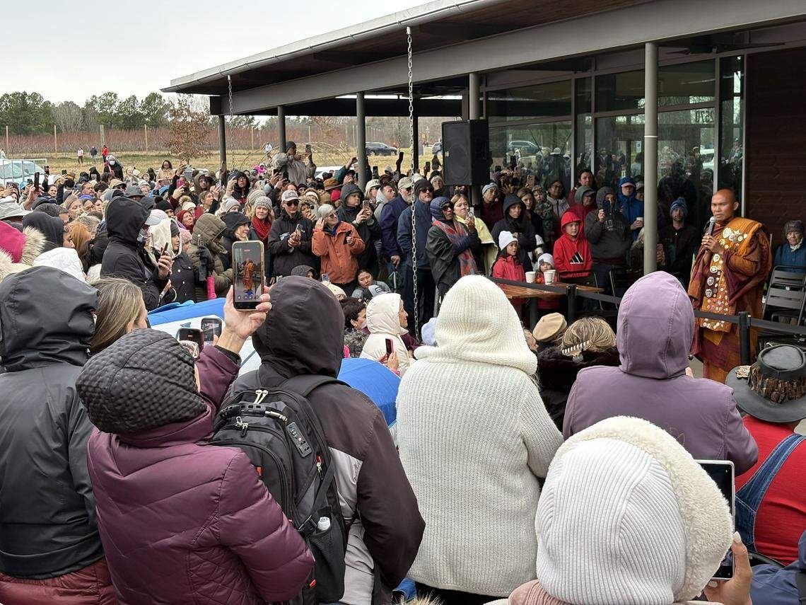 A large crowd gathered Wednesday afternoon at the Anne Springs Close Greenway to meet monks who are walking from Texas to Washington, D.C. Here, group leader Venerable Bhikkhu Pannakara addresses the crowd.
