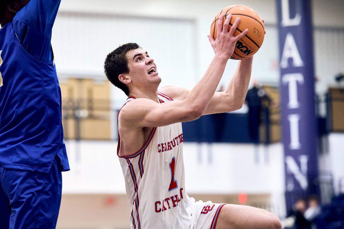 Charlotte Catholic wing Joseph Kapsiak (1) drives to the basket late in the second half of the 2025 Charlotte Latin Invitational Finals against SouthLake Christian.