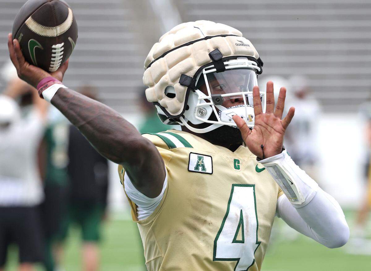 Charlotte 49ers quarterback Jalon Jones passes to a receiver during the team’s first practice on Friday, August 4, 2023.