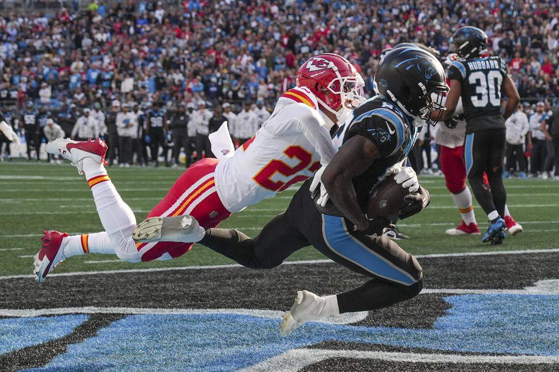Nov 24, 2024; Charlotte, North Carolina, USA;  Carolina Panthers wide receiver David Moore (83) makes a touchdown catch against Kansas City Chiefs cornerback Trent McDuffie (22) during the second half at Bank of America Stadium. Mandatory Credit: Jim Dedmon-Imagn Images