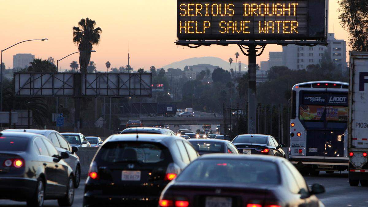 How will rising temperatures and droughts impact the West Coast electric grid, and your utility bills? (AP Photo/Richard Vogel, File)