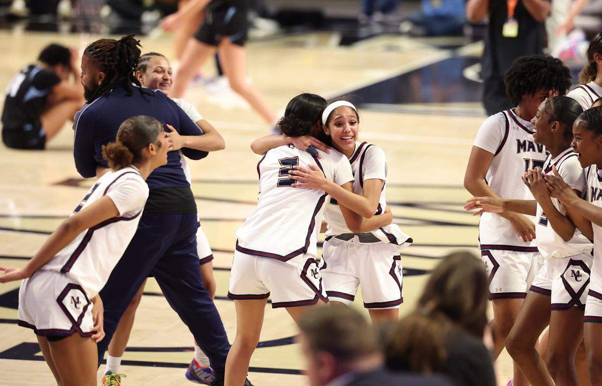 The Mallard Creek girls celebrate their 49-45 victory over Hoggard in the NCHSAA 8A state championship game at Lawrence Joel Veterans Memorial Coliseum in Winston-Salem, NC on Wednesday, March 11, 2026.